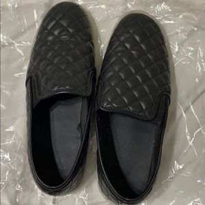 Used black quilted Steve Madden slip ons